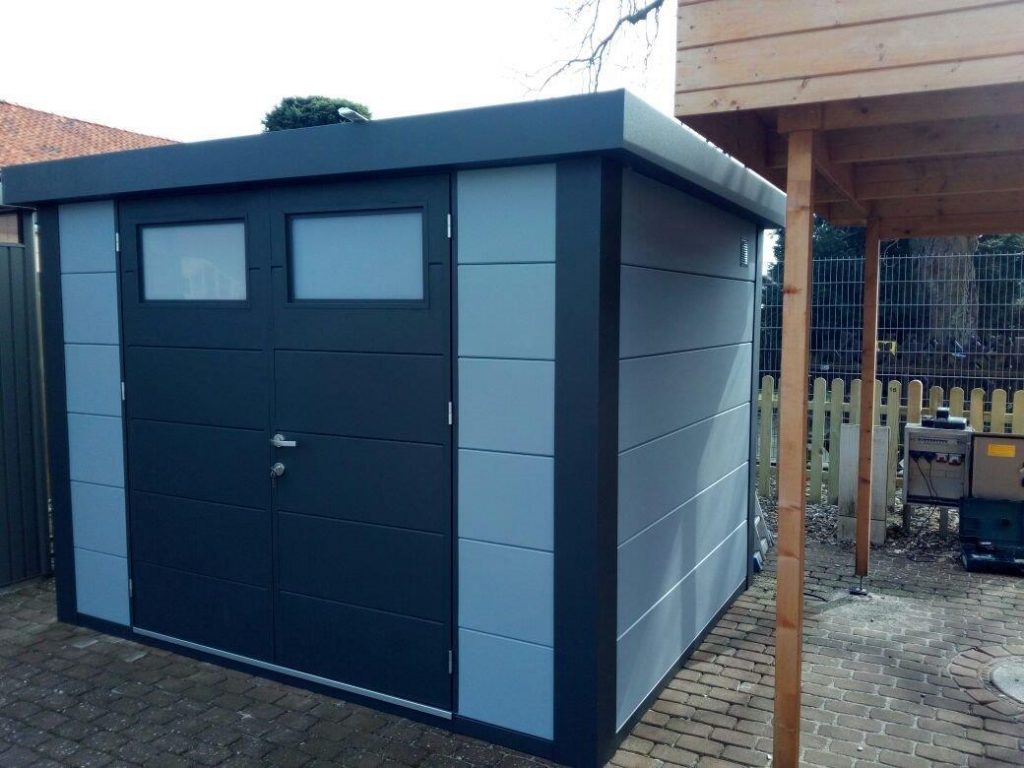 An Angled Photo of The Eleganto 3024 Metal Steel Shed at a School in Light Grey