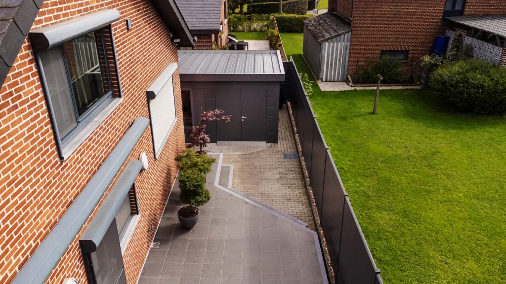 A Photo Taken From Above A Driveway Of The Eleganto 5435 Metal Steel Building In Anthracite