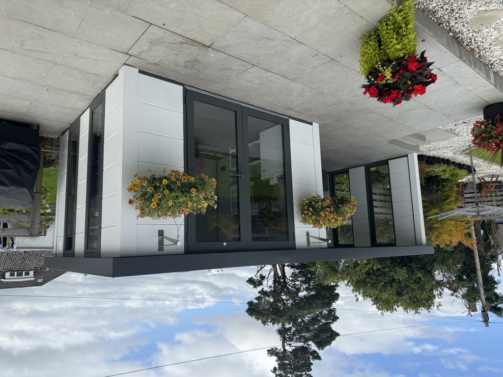 Garden Life Online's COMO 3 garden room with added lounge in White with Anthracite Grey accents. An example of one of the Garden Lounges in Wiltshire by Garden Life Online