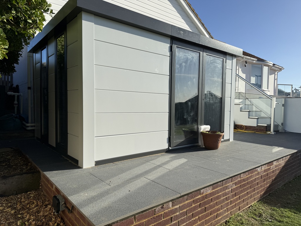 Telluria Luminato 3930 with white cladding beside a swimming pool.