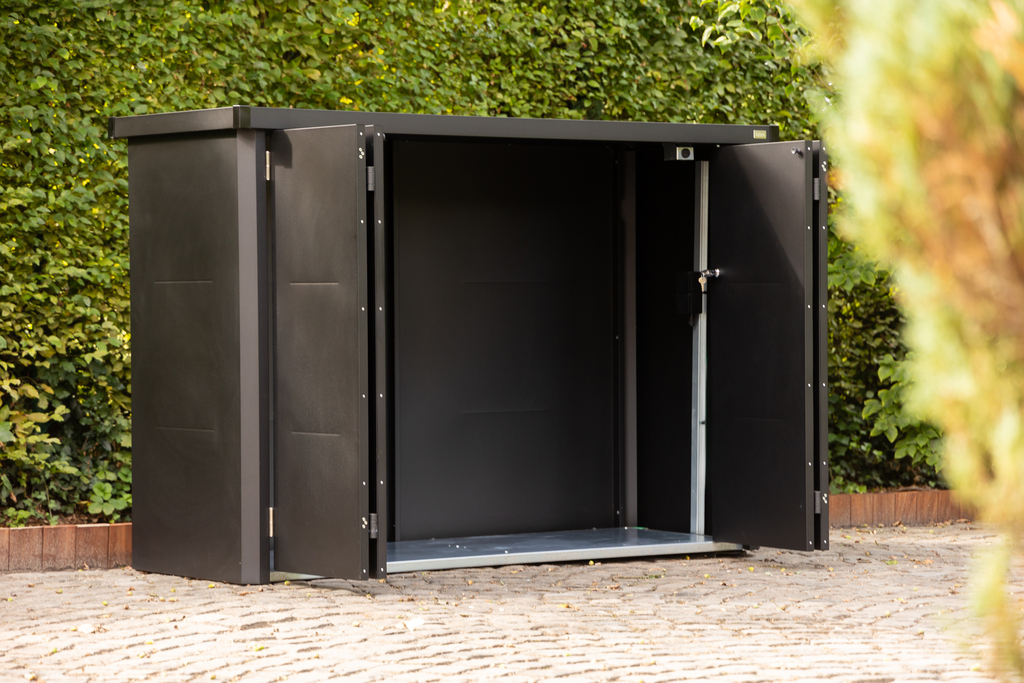 The Telluria Velotto Bicycle Store in Anthracite Grey in the garden with the sliding doors opened